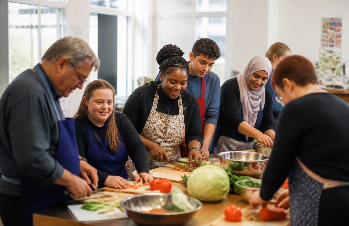 Inclusive cooking workshop with participants and instructors